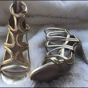 Gold strapped gladiators heels